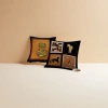 Black background patterned gourd-patterned cushions, brown leather sofa paired with white porcelain coffee cups, plates and booklets details Picture